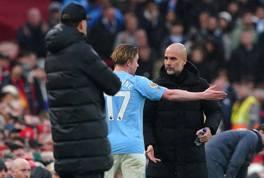 Manchester City's Kevin De Bruyne argues with manager Pep Guardiola after being substituted during the Premier League match at Anfield