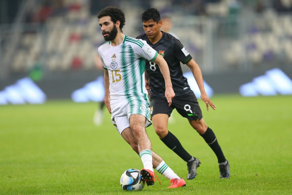 Rayan Ait-Nouri of Algeria (l) challenges Jaume Cuellar of Bolivia (r) during the FIFA Series Algeria Edition 2024 match between Algeria and Bolivia held at Nelson Mandela Stadium in Algiers , Algeria on 22 March 2024