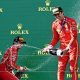 Ferrari's Charles Leclerc of Monaco (L) and Carlos Sainz of Spain celebrate second and first place respectively following the Australian Grand Prix 2024 at Albert Park Circuit in Melbourne.