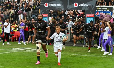 Lukhanyo Am, captain of Hollywoodbets Sharks leads his team onto the field during the 2024 United Rugby Championship 2023/24 game between the Sharks and Stormers at Kings Park Stadium.
