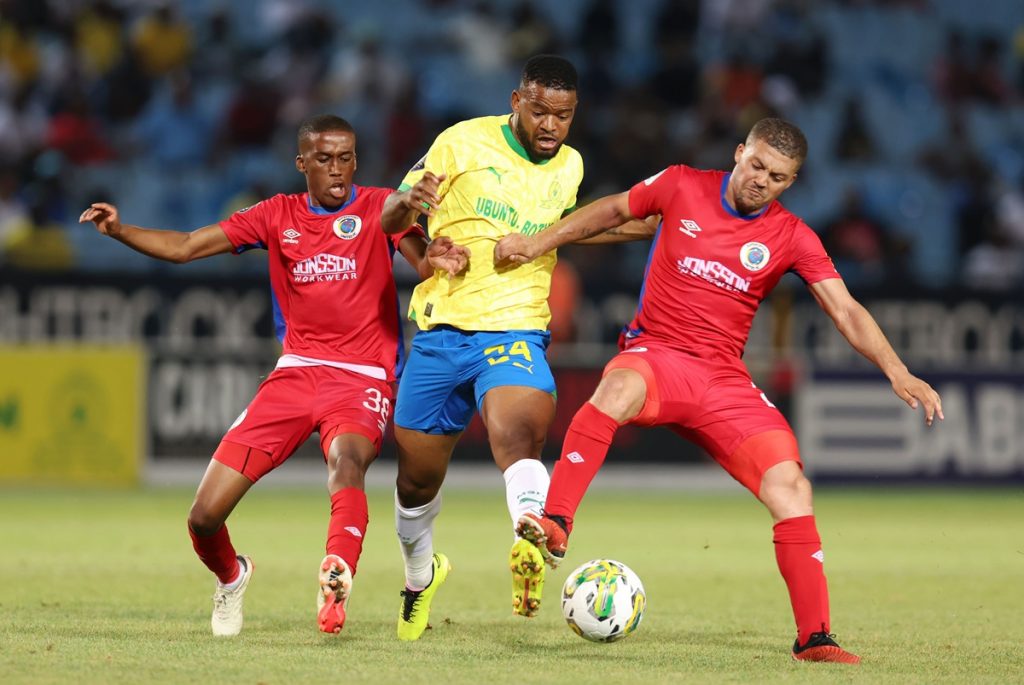 Sipho Mbule of Mamelodi Sundowns challenged by Grant Margeman and Gape Moral of SuperSport United during the DStv Premiership 2023/24 match between Mamelodi Sundowns and Supersport United at the Loftus Stadium.