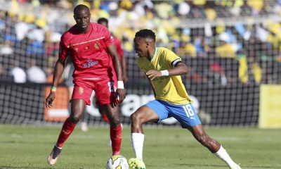 Themba Zwane of Sundowns (R) and Bouly Junior Sambou of Wydad (L) in action during the CAF Champions League semi-finals, 2nd leg soccer match between Mamelodi Sundowns and Wydad Casablanca in Pretoria, South Africa, 20 May 2023. Wydad advance to the final on away goals after drawing 2-2 on aggregate against Mamelodi