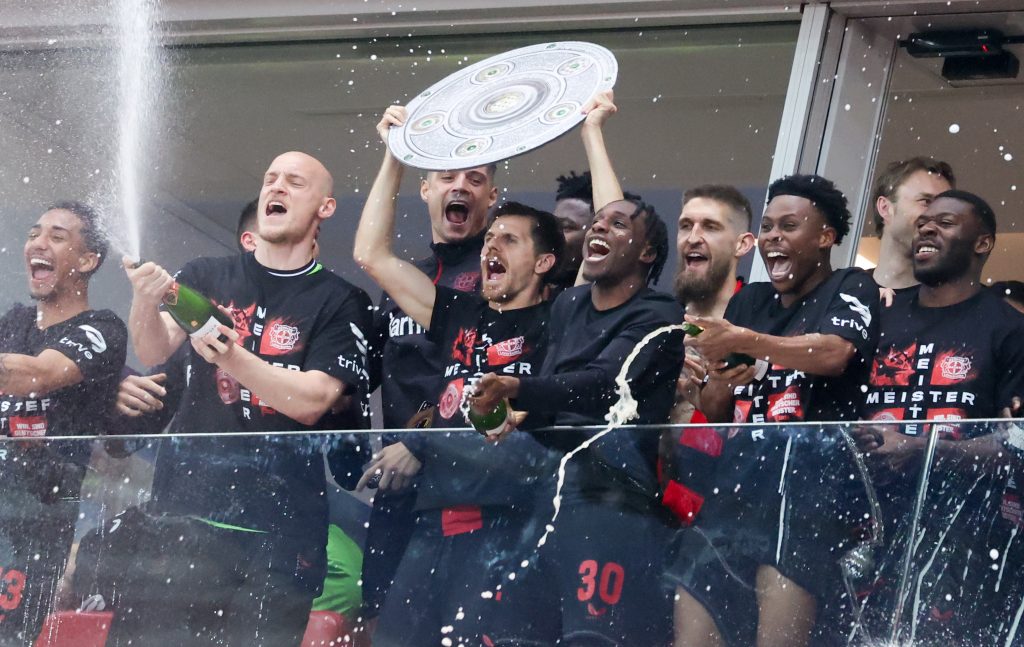 Players of Leverkusen celebrate the German Bundesliga championship after the German Bundesliga soccer match between Bayer 04 Leverkusen and SV Werder Bremen in Leverkusen, Germany, 14 April 2024.