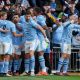 Bernardo Silva (C-L) of Manchester City celebrates with teammates after scoring the opening goal during the FA Cup semi-final soccer match of Manchester City against Chelsea FC, in London, Britain, 20 April 2024