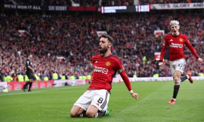 Manchester United's Bruno Fernandes celebrates after scoring the 1-1 goal during the English Premier League soccer match between Manchester United and Liverpool.