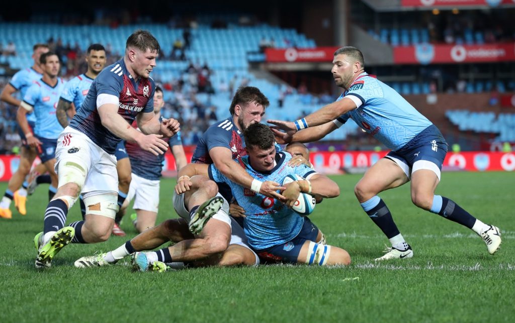 Elrigh Louw of Bulls challenged by Alex Nankivell of Munster during the Vodacom United Rugby Championship 2023/24 match between Bulls and Munster at Loftus Versfeld Stadium.