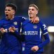 Chelsea's Cole Palmer (right) celebrates scoring their side's second goal of the game with team-mate Enzo Fernandez during the Premier League match at Stamford Bridge, London. Picture date: Monday March 11, 2024.
