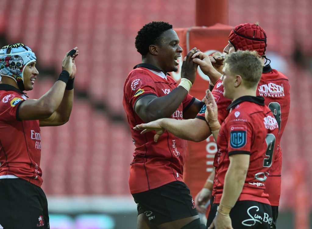 Lions players celebrating a try during a United Rugby Championship clash at Ellis Park.