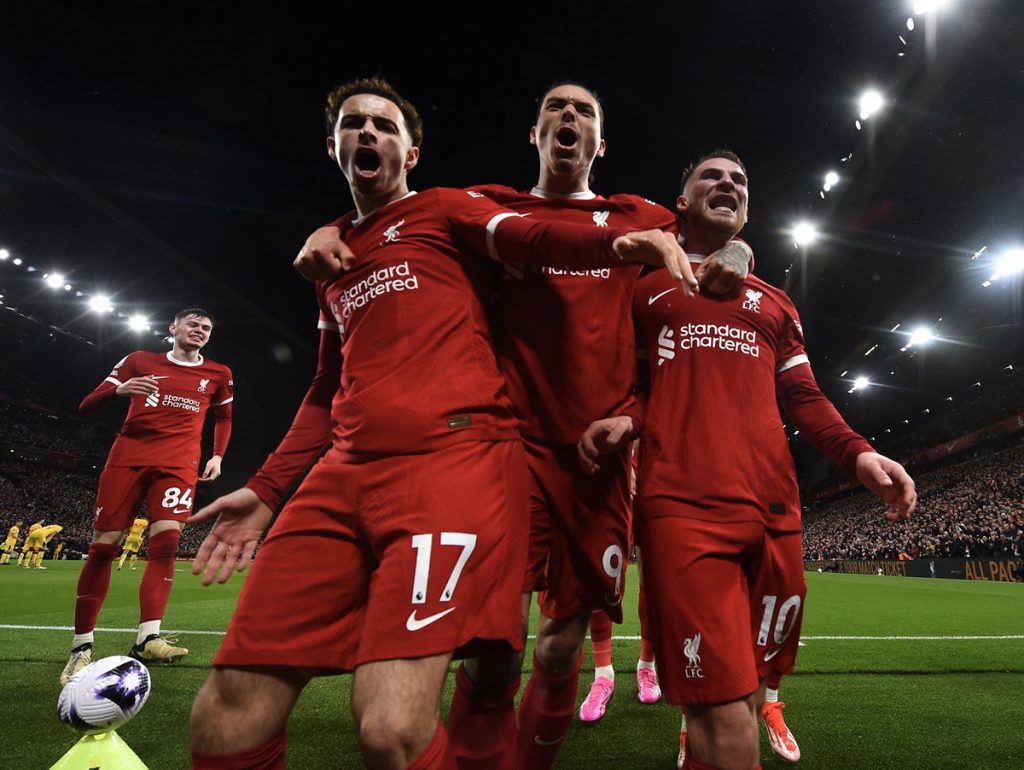 Alexis Mac Allister of Liverpool celebrates with Curtis Jones and Darwin Nunez after scoring the 2-1 goal during the English Premier League match at Anfield.