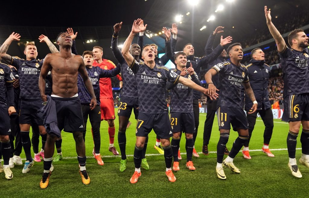 Real Madrid players celebrate following the UEFA Champions League quarter-final, second leg match at the Etihad Stadium, Manchester. Picture date: Wednesday April 17, 2024.