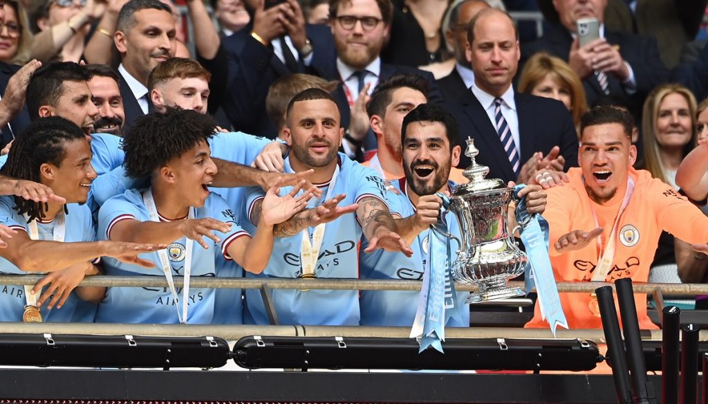 Manchester City's Nathan Ake, Rico Lewis, Kyle Walker, Ilkay Gundogan, and goalkeeper Ederson celebrate with the FA Cup trophy after winning the FA Cup final soccer match between Manchester City and Manchester United, in London, Britain, 03 June 2023. EPA/ANDY RAIN EDITORIAL USE ONLY. No use with unauthorized audio, video, data, fixture lists, club/league logos or 'live' services. Online in-match use limited to 120 images, no video emulation. No use in betting, games or single club/league/player publications.