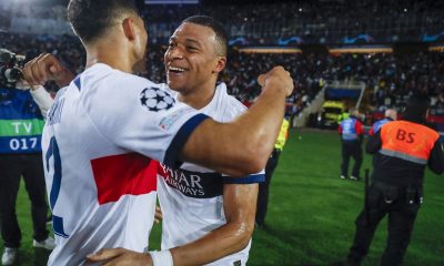 PSG's Kylian Mbappe celebrates with his teammates after scoring the 1-4 goal during the UEFA Champions League quarter finals second leg soccer match between FC Barcelona and Paris Saint-Germain at the Nou Camp.