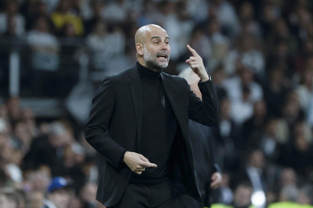 Manchester City's head coach Pep Guardiola gestures during the UEFA Champions League quarter finals first leg soccer match soccer match between Real Madrid and Manchester City.