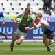 Quewin Nortje of South Africa scores a try despite the efforts of Jamie Barden of Great Britain during day one of the 2023 HSBC Cape Town Sevens at Cape Town Stadium on 9 December 2023