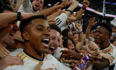 Real Madrid's Brazilian strikers Vini Jr (R) and Rodrygo (L) celebrate with supporters the 3-2 lead of British midfielder Jude Bellingham (not seen) during the LaLiga soccer match between Real Madrid and FC Barcelona, at the Santiago Bernabeu stadium in Madrid, Spain, 21 April 2024. EPA/JUANJO MARTIN