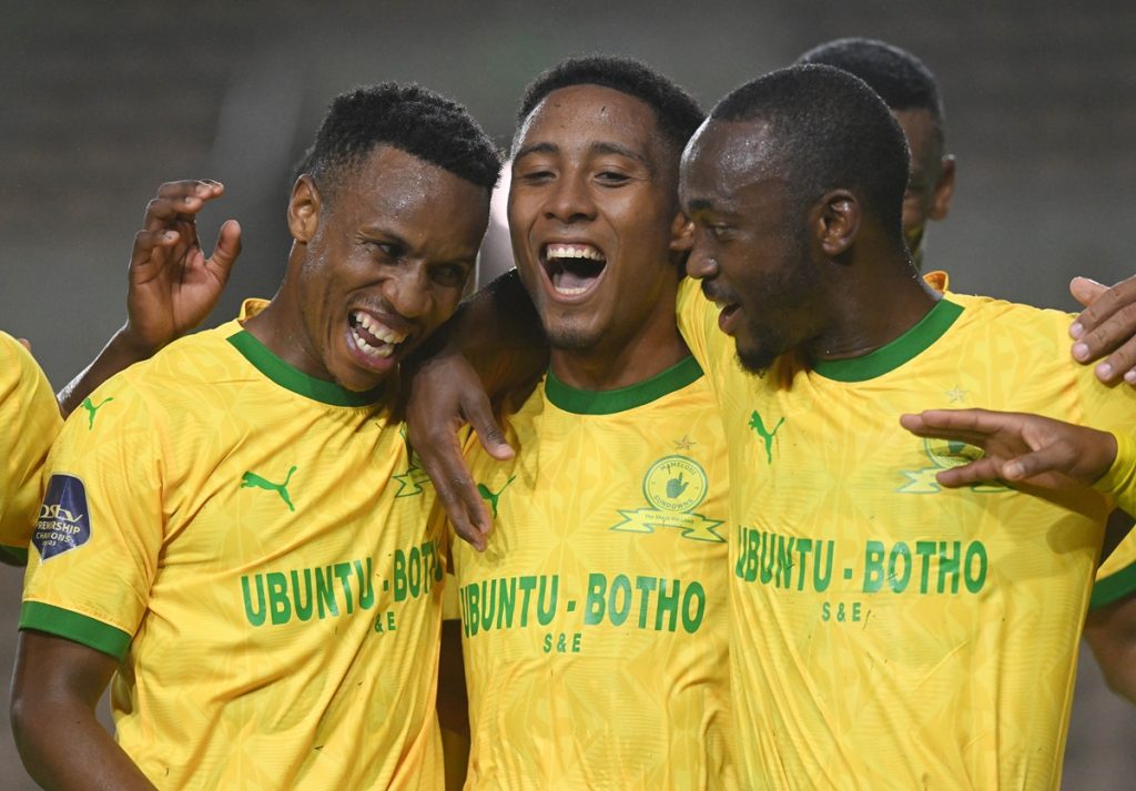 Lucas Rebeiro Costa of Mamelodi Sundowns celebrates with teammates Themba Zwane and Peter Shalulile after scoring from the penlty spot during the DStv Premiership 2023/24 football match between Cape Town Spurs and Mamelodi Sundowns at Athlone Stadium.