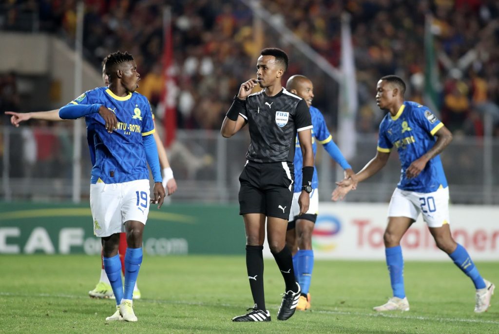 Bathusi Aubaas of Mamelodi Sundowns speaks with Referee Omar Artan during the CAF Champions League 2023/24 1st leg semifinal match between Esperance Tunis and Mamelodi Sundowns at Stade Olympique.