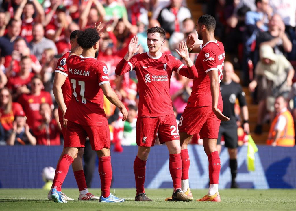 Andrew Robertson of Liverpool (C) celebrates with his teammates after scoring the 2-0 goal during the English Premier League soccer match between Liverpool FC and Tottenham Hotspur in Liverpool, Britain, 05 May 2024. EPA/ADAM VAUGHAN EDITORIAL USE ONLY. No use with unauthorized audio, video, data, fixture lists, club/league logos or 'live' services. Online in-match use limited to 120 images, no video emulation. No use in betting, games or single club/league/player publications.