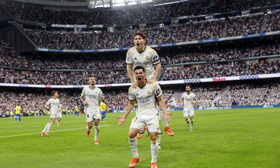 Real Madrid's Brahim Diaz (C-bottom) celebrates with his teammate Fran Garcia after scoring the 1-0 goal during the Spanish LaLiga soccer match between Real Madrid and Cadiz in Madrid.