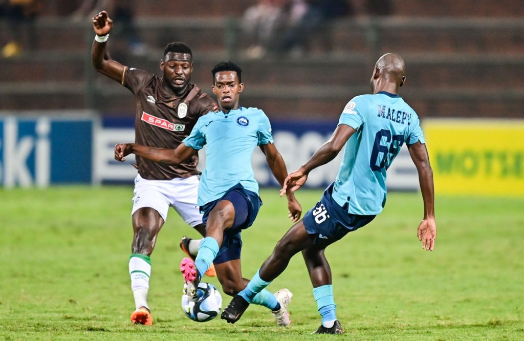 Michael Gumede of Richards Bay FC challenges Abel Mabaso of Richards Bay FC and Tercious Malepe of Richards Bay FC during the DStv Premiership 2023/24 game between Richards Bay and AmaZulu at King Zwelithini Stadium.