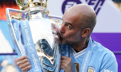 Manchester City manager Pep Guardiola kisses the Premier League trophy after the Premier League match at the Etihad Stadium, Manchester. Picture date: Sunday May 19, 2024.