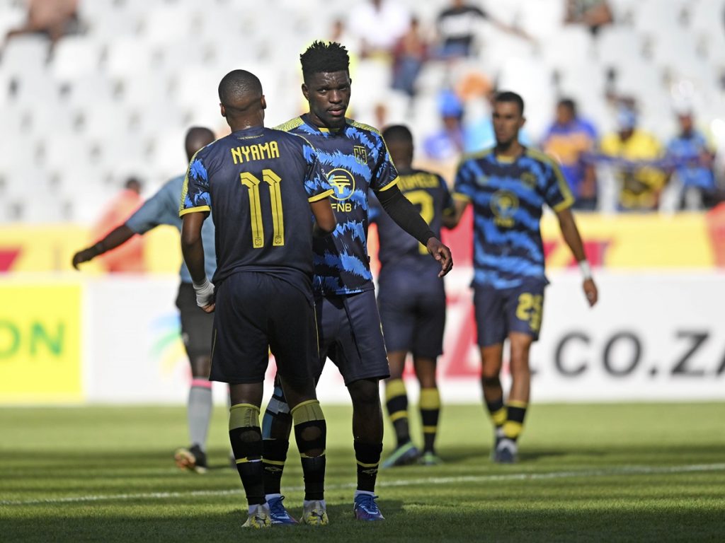 Tshegofatso Nyama and Fidel Brice Ambina of Cape Town City celebrate victory at the final whistle after the DStv Premiership 2023/24 football match between Cape Town Spurs and Cape Town City at Cape Town Stadium on 31 December 2023