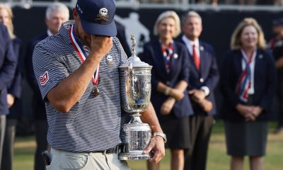 Bryson DeChambeau of the US shows emotions after being presented with the 2024 US Open Championship trophy after winning the golf tournament at Pinehurst No. 2 course.