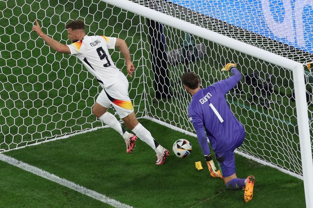Niclas Fuellkrug (L) of Germany celebrates after scoring a goal which was ruled offside by the VAR during the UEFA EURO 2024 group A match between Germany and Scotland in Munich.