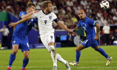 Jaka Bijol of Slovenia (L) and Harry Kane of England (C) in action during the UEFA EURO 2024 group C soccer match between England and Slovenia, in Cologne.