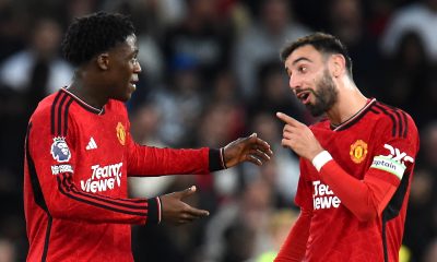 Bruno Fernandes (R) of Manchester United talks to teammate Kobbie Mainoo after Mainoo scored the opening goal during the English Premier League soccer match between Manchester United and Newcastle United in Manchester, Britain, 15 May 2024.