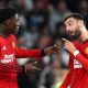 Bruno Fernandes (R) of Manchester United talks to teammate Kobbie Mainoo after Mainoo scored the opening goal during the English Premier League soccer match between Manchester United and Newcastle United in Manchester, Britain, 15 May 2024.