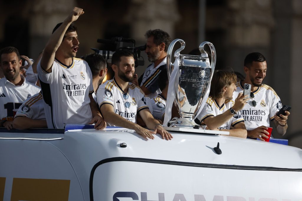 Real Madrid's team celebrate during an open-top bus parade of the team in Madrid, Spain, 02 June 2024. Real Madrid won the UEFA Champions League 2024 final soccer match against Borussia Dortmund on 01 June 2024. EPA/JuanJo Martin