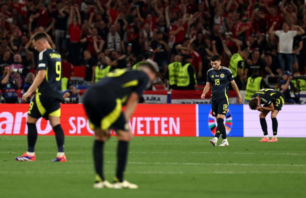 Lewis Morgan of Scotland and teammates react after Hungary scored during the UEFA EURO 2024 Group A soccer match between Scotland and Hungary, in Stuttgart.