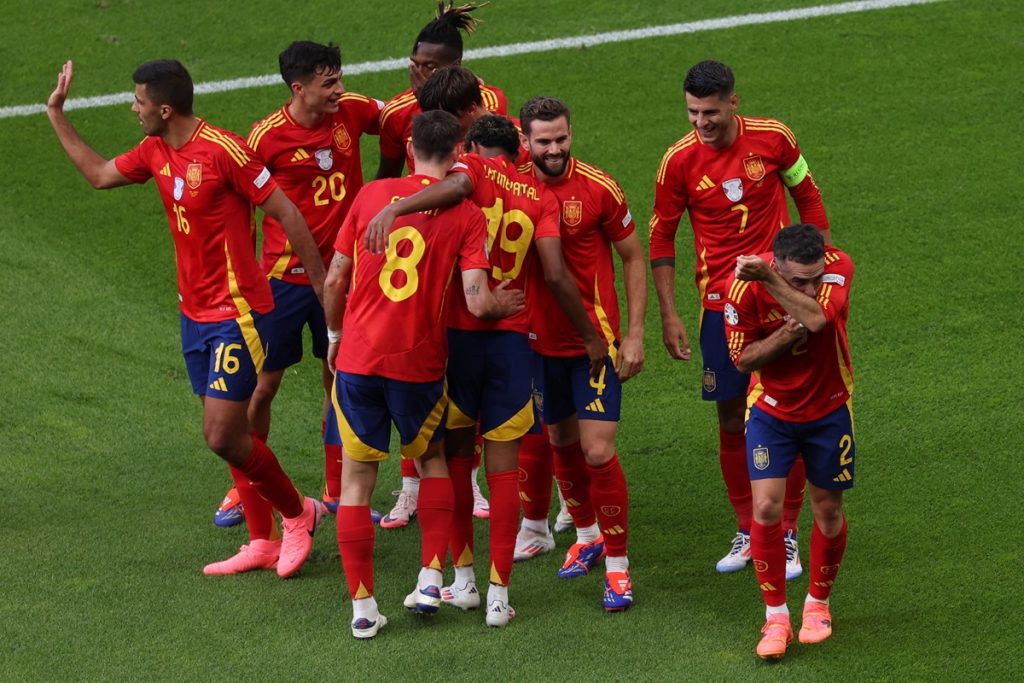 Dani Carvajal of Spain (R) celebrates with his teammates after scoring the 3-0 goal during the UEFA EURO 2024 group B match between Spain and Croatia in Berlin.