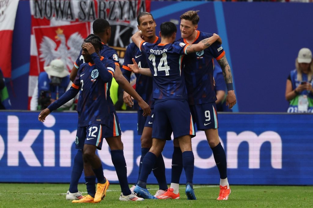 Wout Weghorst (R) of the Netherlands celebrates after scoring the 2-1 goal during the UEFA EURO 2024 group D match between Poland and Netherlands, in Hamburg.