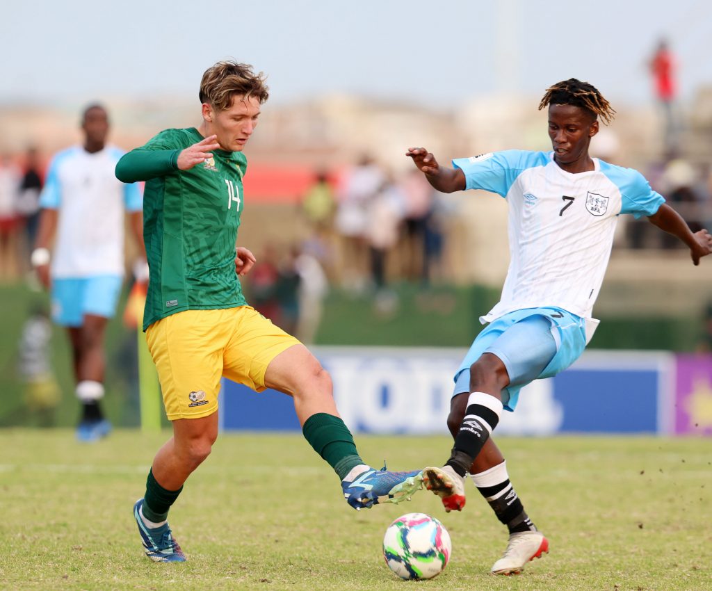 Liam Bern of South Africa challenged by Oarabile Sekwai of Botswana during the 2024 Hollywoodbets COSAFA Mens Championship match between South Africa and Botswana at the Wolfson Stadium, Gqeberha on the 29 June 2024.