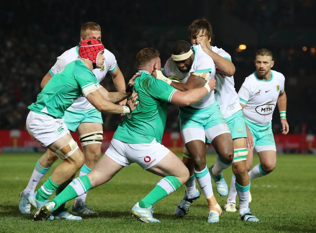 Siya Kolisi of South Africa challenged by Tadhg Furlong of Ireland during the 2024 Castle Lager Incoming Series match between South Africa and Ireland at Loftus Versfeld Stadium.