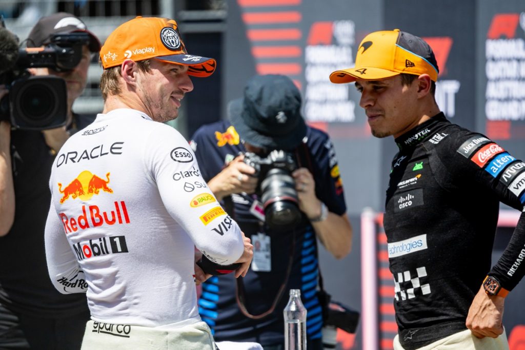 First placed Red Bull Racing driver Max Verstappen of Netherlands (L) talks to third placed McLaren driver Lando Norris of Britain.