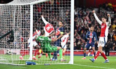 Kai Havertz (R) of Arsenal celebrates as the ball hits the back of the net for Arsenal's second goal during the UEFA Champions League match between Arsenal and Paris Saint-Germain in London.